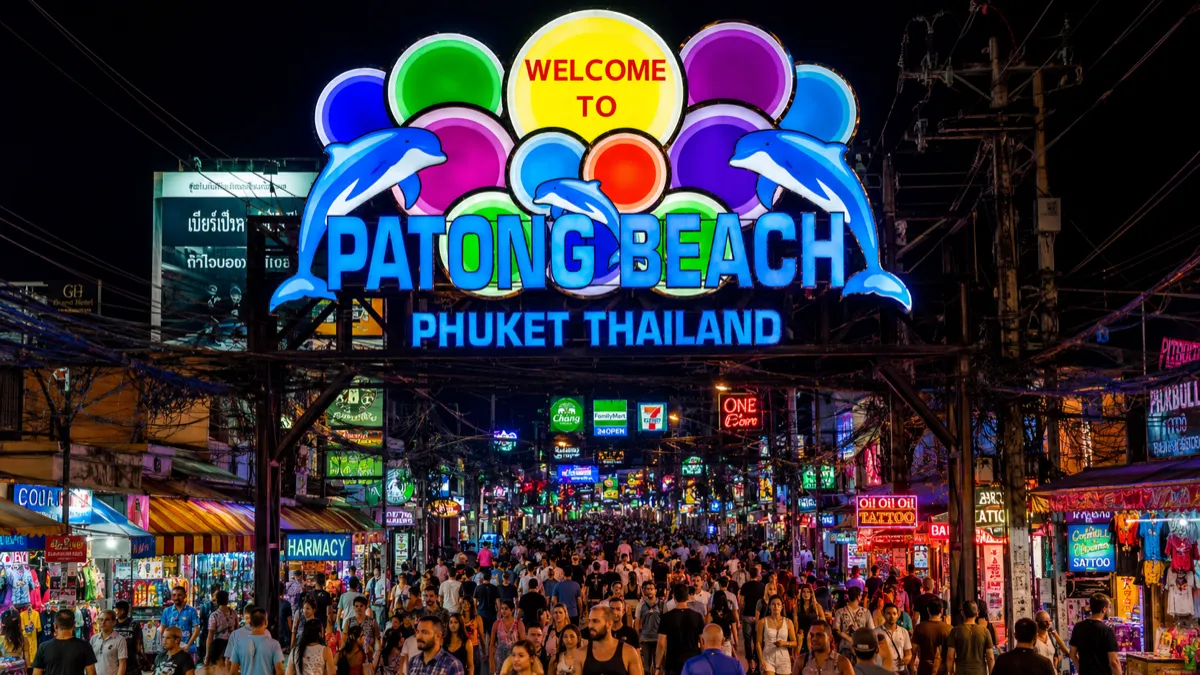 Bangla Road at night in Phuket with neon signs of clubs and bars