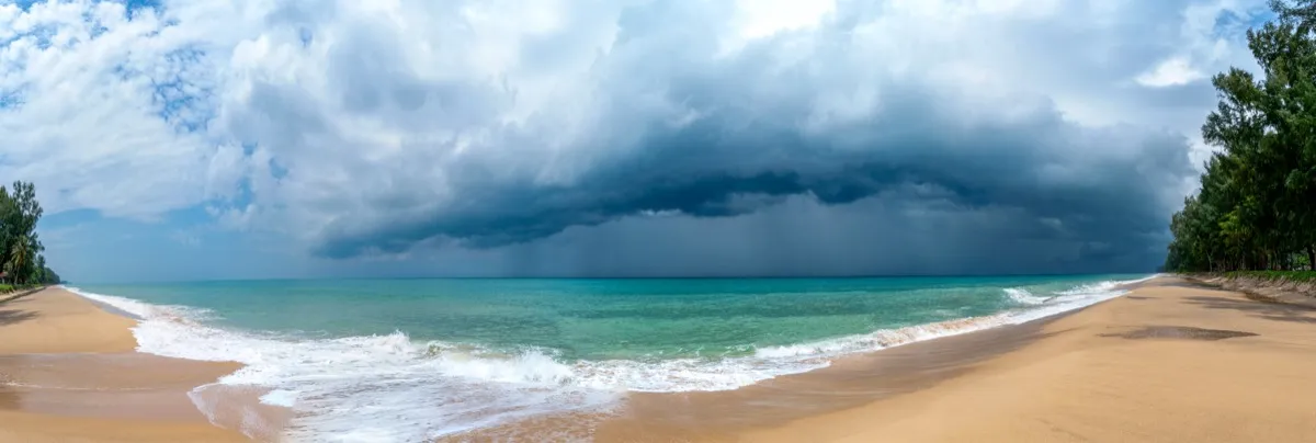 Phuket in June — green hills and clouds over the island during rainy season